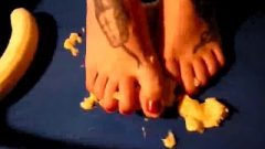 Beautiful Tattoo’d Feet And Toes Crushes Banana