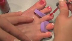 BRANDI BELL PAINTS HER TOES