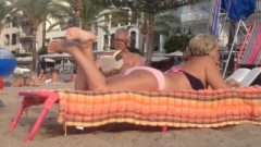 Granny’s Candid Feet And Soles Rubbing At The Beach