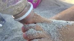 Young Hispanic Feet Massaged With Sand