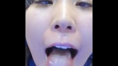 Voluptuous Chinese Girl Opens Mouth, Crosses Eyes, And Flashes Feet