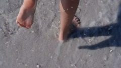 Wholesome Teen Getting Her Feet Wet At The Muddy Beach
