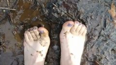 Bare Feet In Muddy Puddle With Voice 57 Seconds