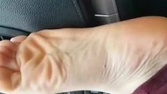SHOWING HER SEXY FEET IN MY CAR