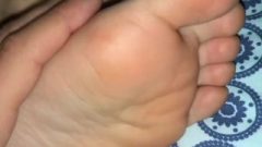 Rubbing And Massaging Her Sleepy Feet