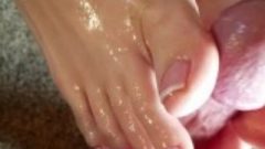 Nice Cece Gives An Oiled Up Footjob With Cum-Shot