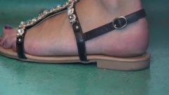 Candid Feet In Open Sandals Shoes Close-up