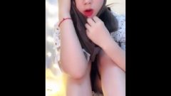 Thai Girl Plays With Feet In White Nylons