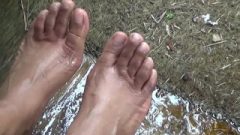 Provocative Ebony Feet Being Washed Outdoors