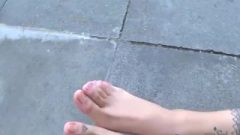 Nerdy Girl Flashes Her Titillating Feet On Camera!