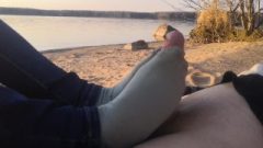 Public Footjob And Socksjob On The Beach
