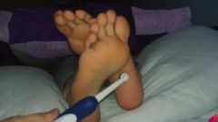 Tickling Bare Feet With Electric Toothbrush And Fingers