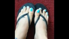 Showing Off A Fresh Pedicure On Enormous Suggestive Feet With Long Sky Blue Toes