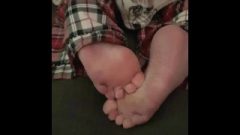 Wriggling Bare Soles Feet And Toes
