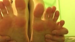 Young Close Up Playing With Toes